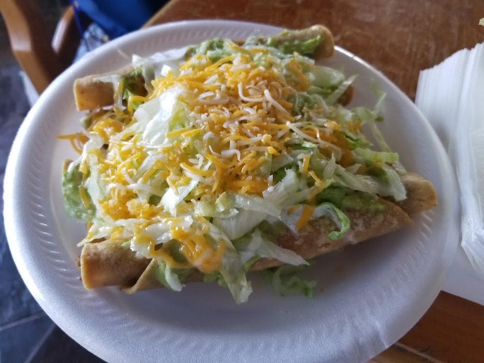 Mexican menu with tacos, tostadas, and taquitos.